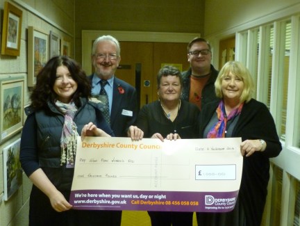 Glossopdale County Councillors Dave Wilcox, Ellie Wilcox and Damien Greenhalgh hand over their cheque to Chair of HPWA, Linda Rundle and Service Manager, Pam Whittle.